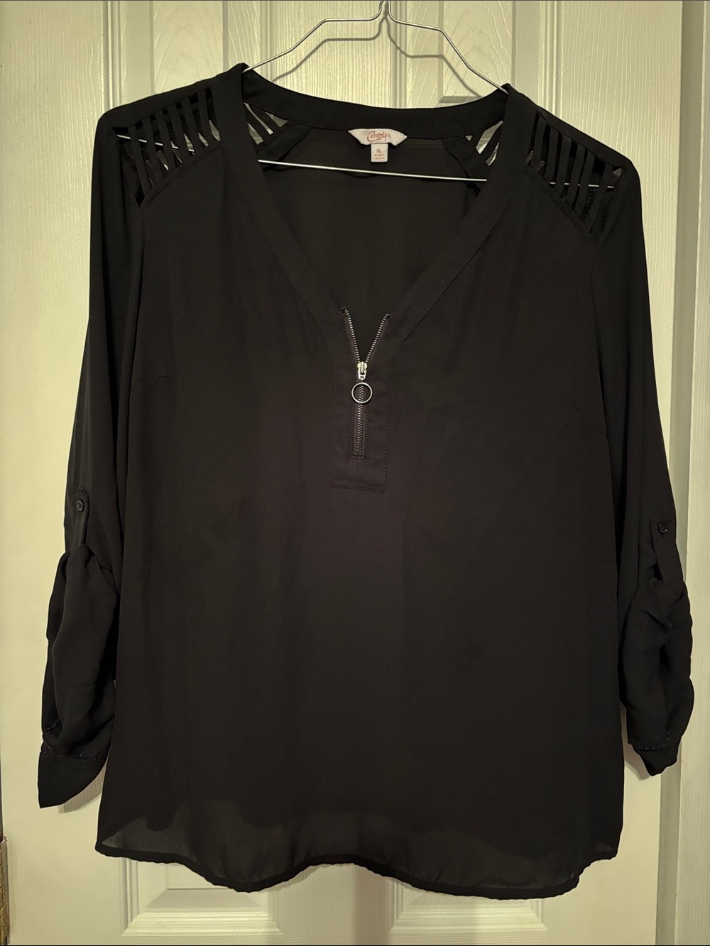 Candie's black zip-front blouse with shoulder cutouts